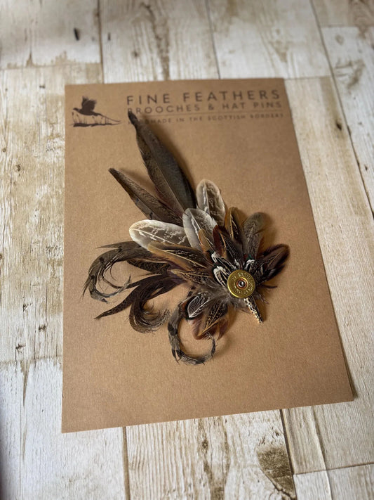 Feather Brooch or Hat Pin with brass cartridge casing