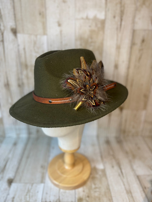 Pheasant feather hat pin with brass casing.