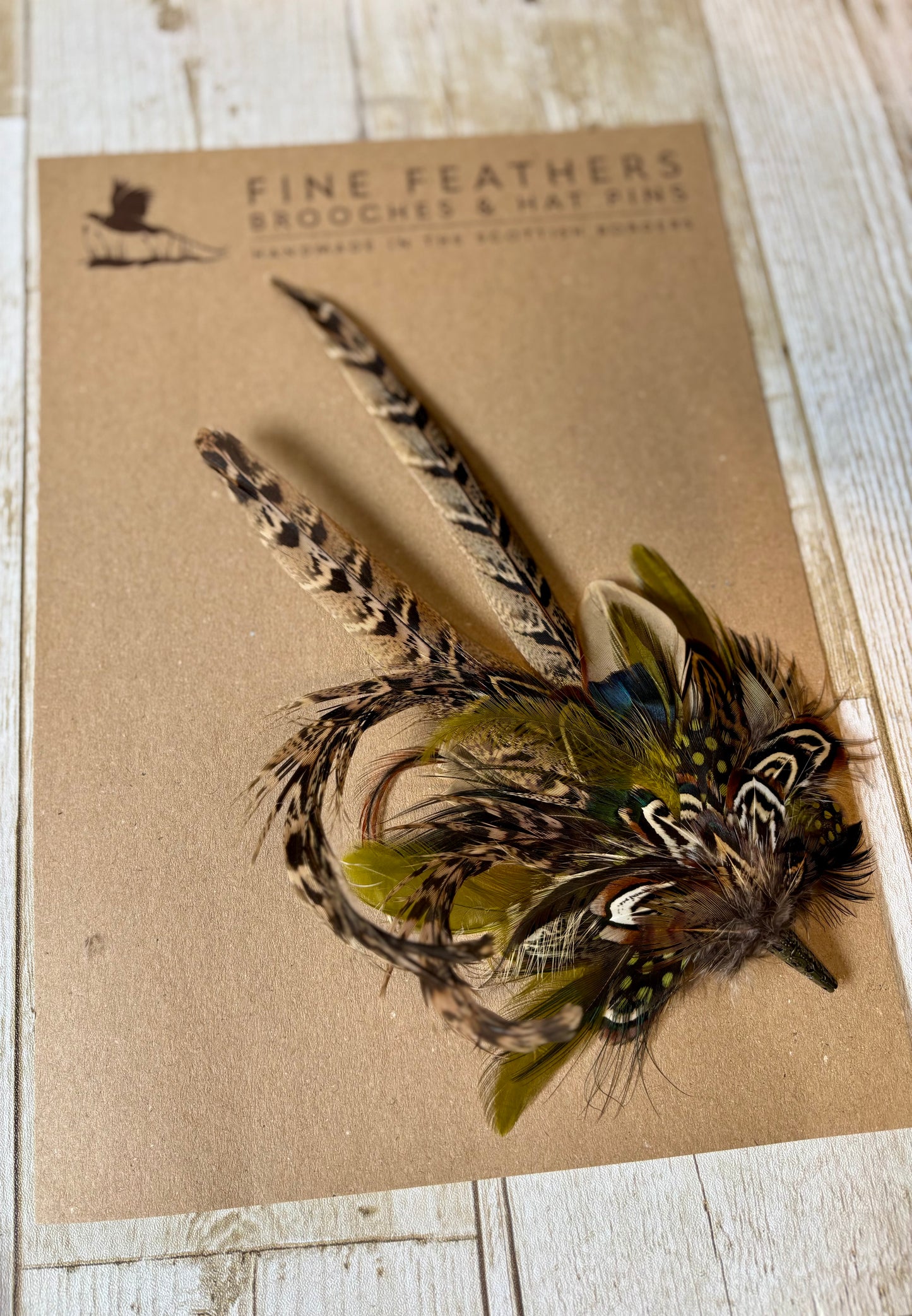 Pheasant feather hat pin.