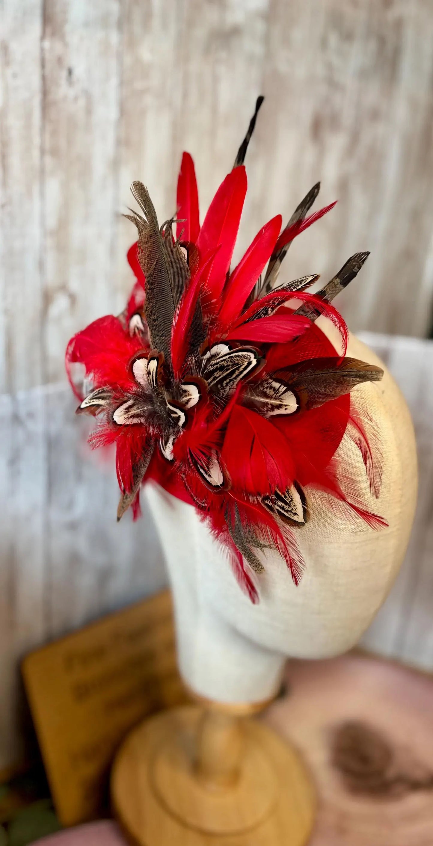 Uniquely designed pheasant feather and sinamay fascinator