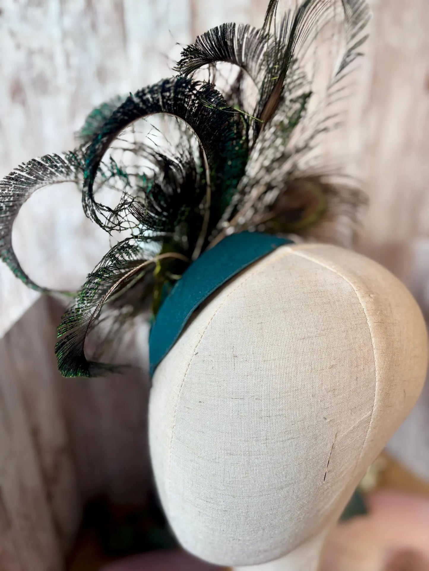 Uniquely designed pheasant feather and sinamay fascinator