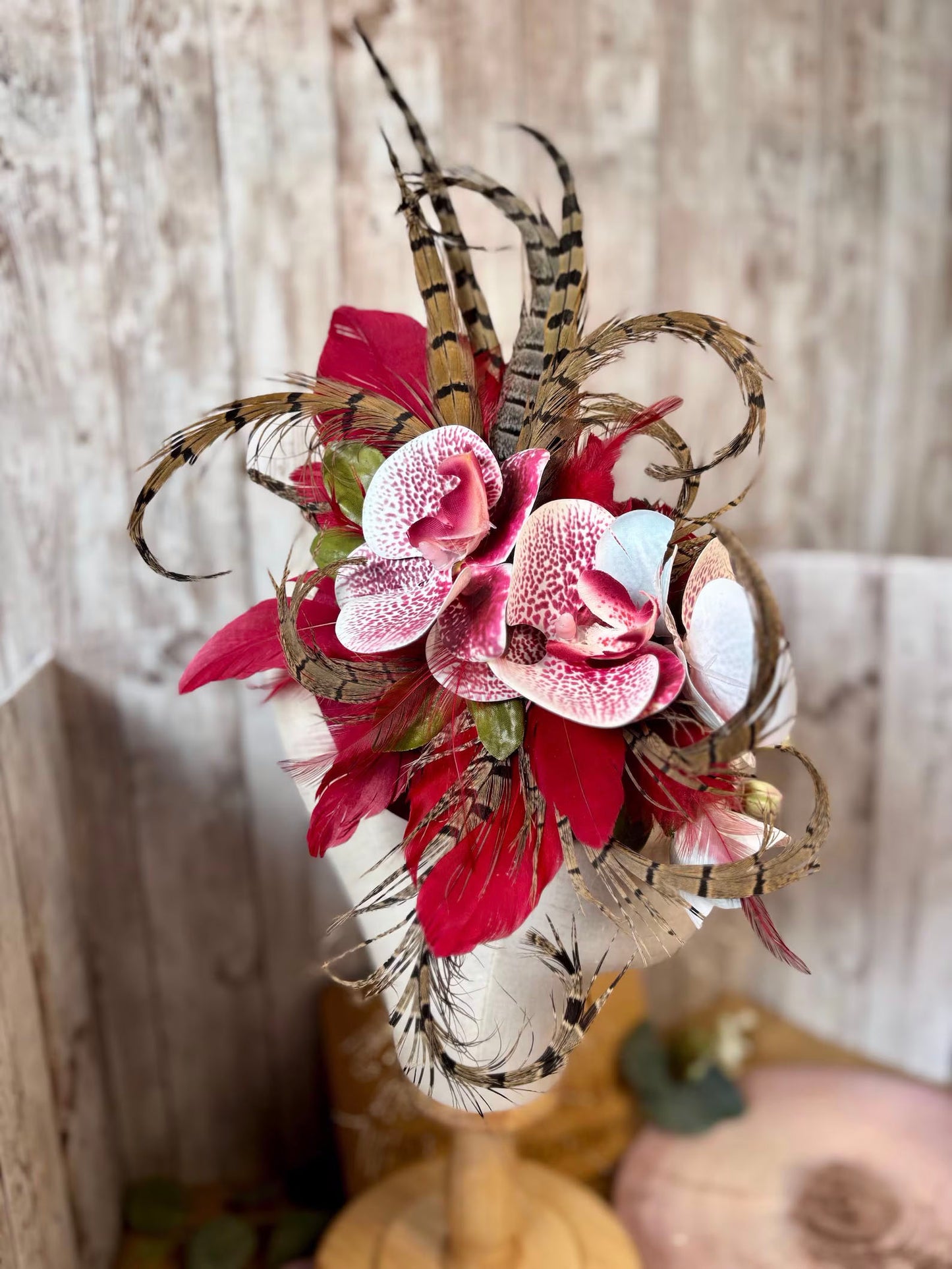 Uniquely designed pheasant feather and sinamay fascinator