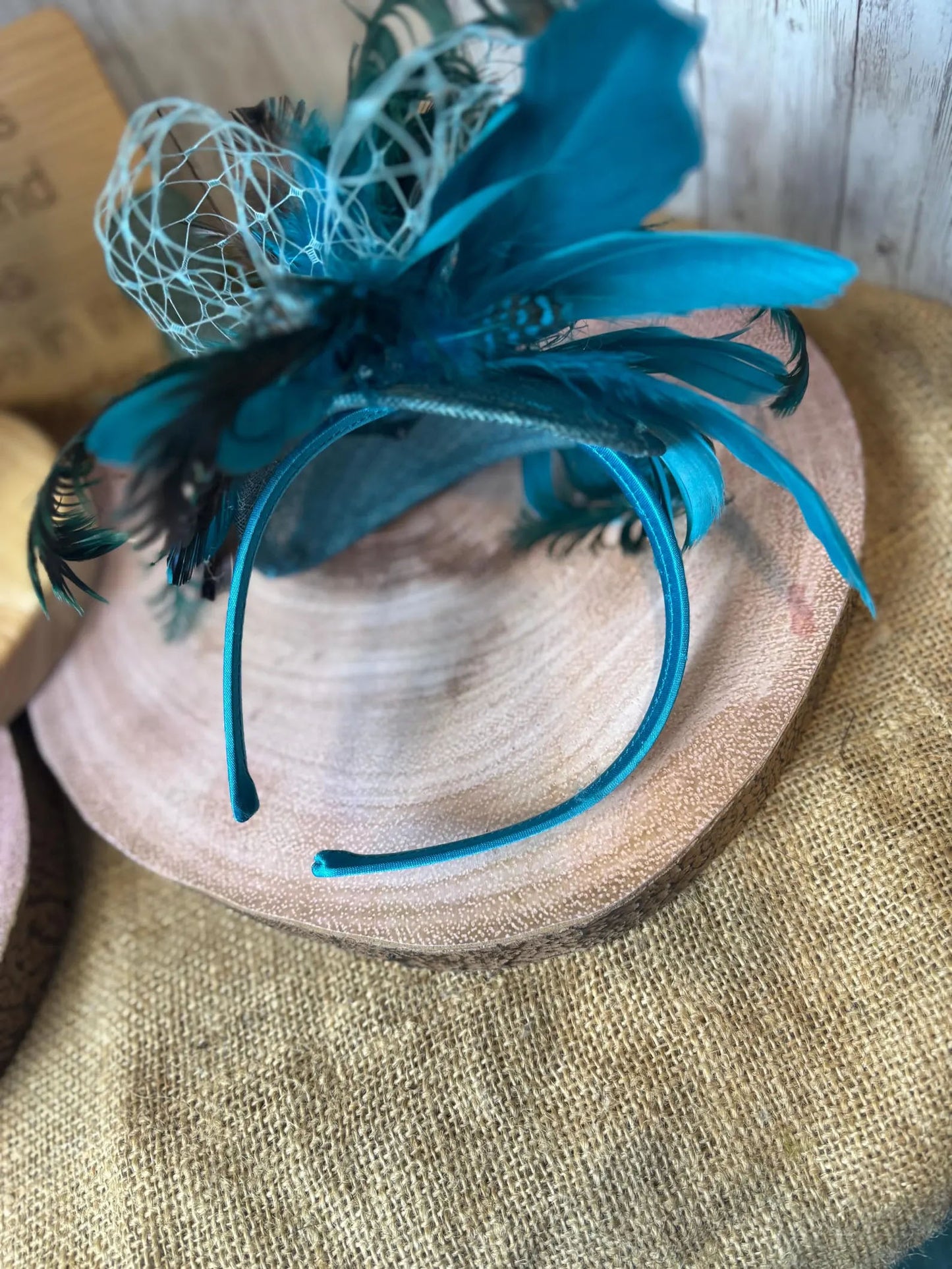 Uniquely designed pheasant feather and sinamay fascinator.