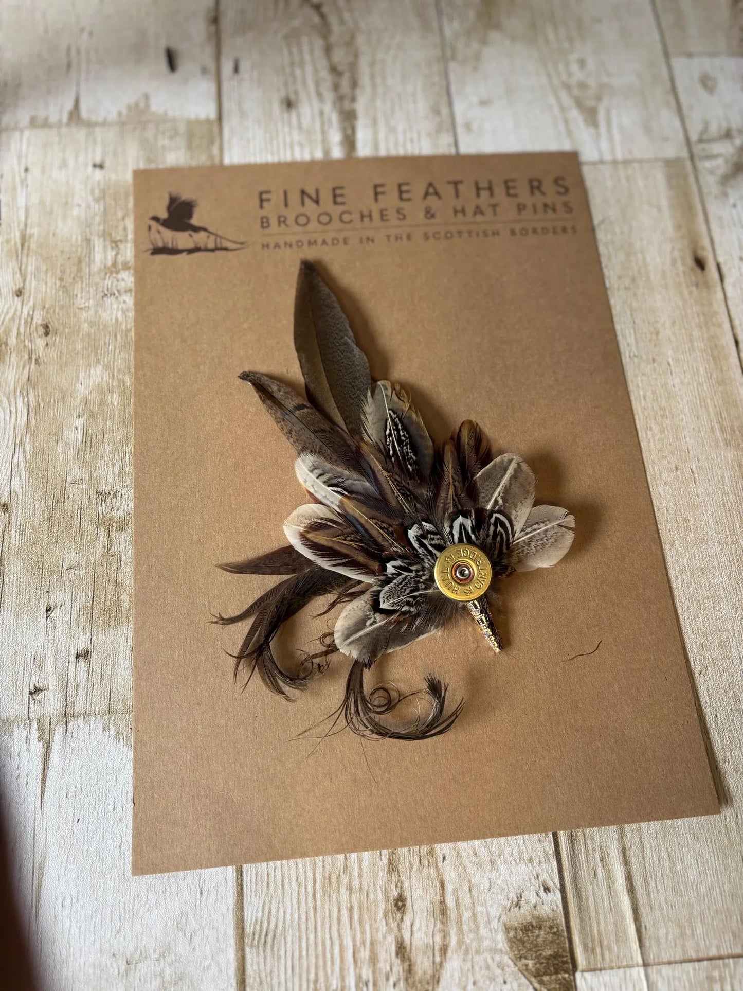 Feather Hat Pin in natural pheasant with cartridge casing