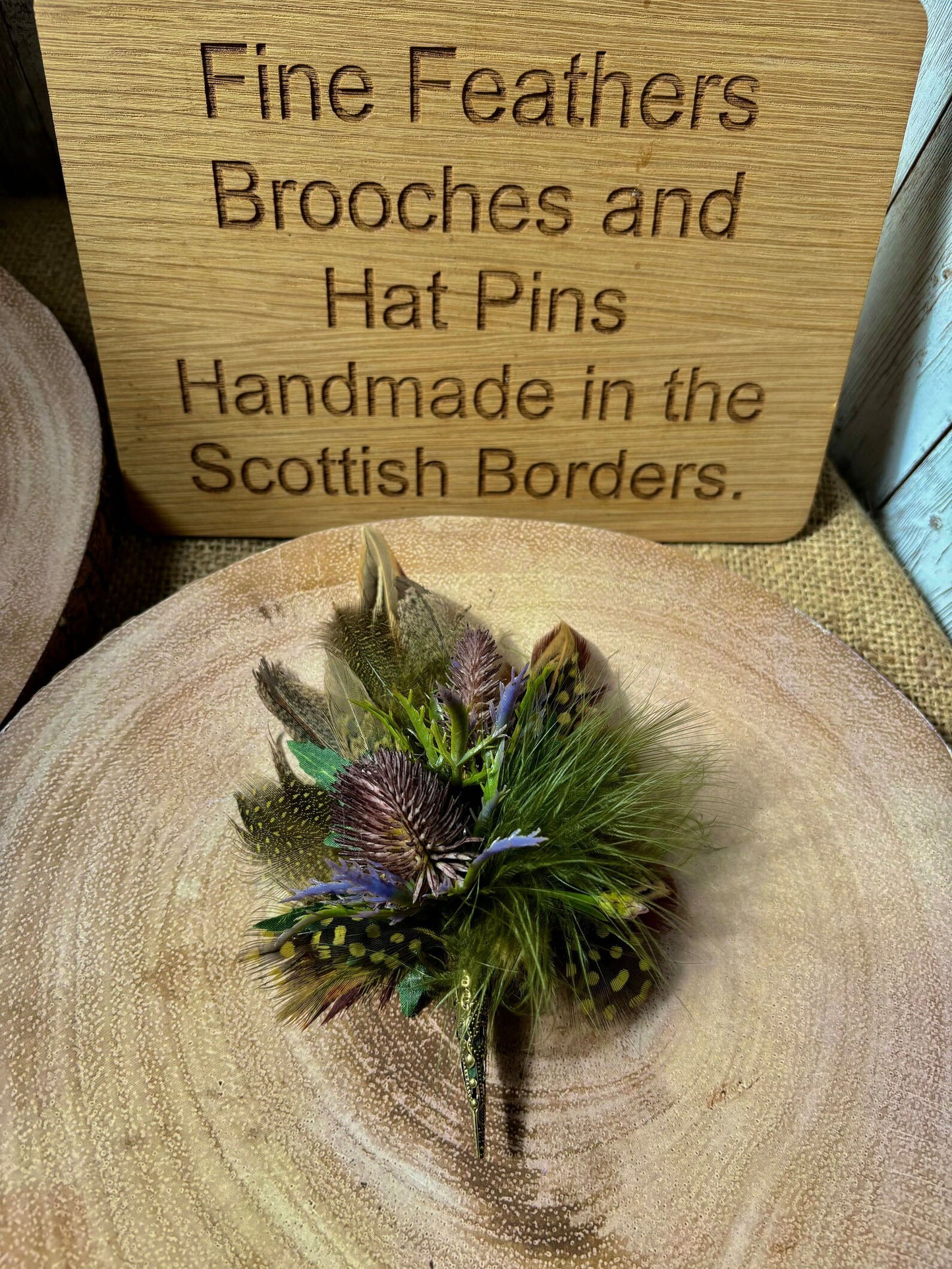 Feather brooches and buttonholes: Made to order to match your outfit