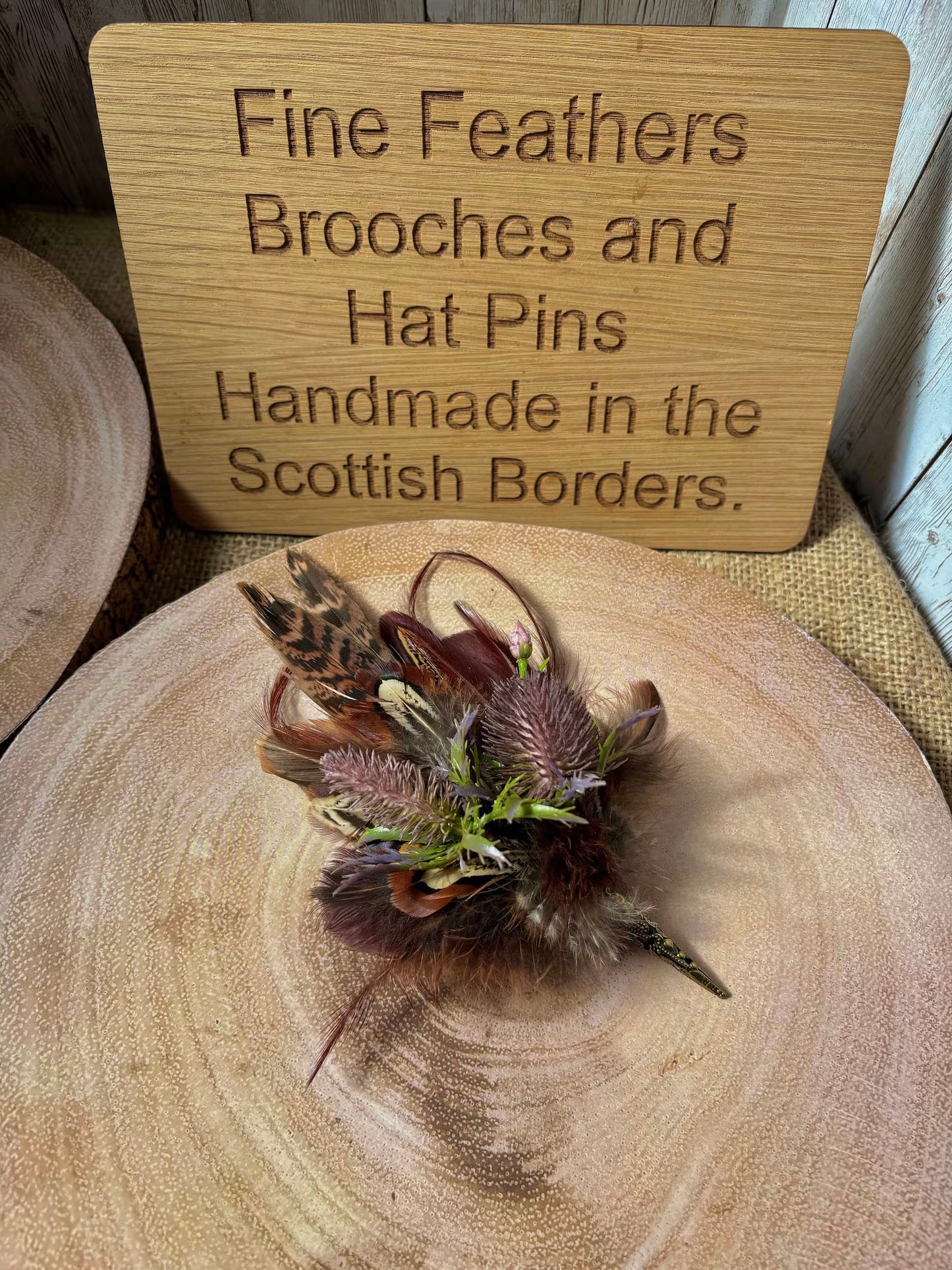 Feather brooches and buttonholes: Made to order to match your outfit