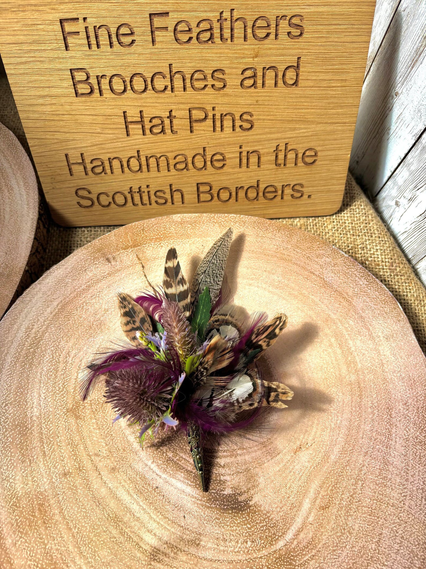 Feather brooches and buttonholes: Made to order to match your outfit