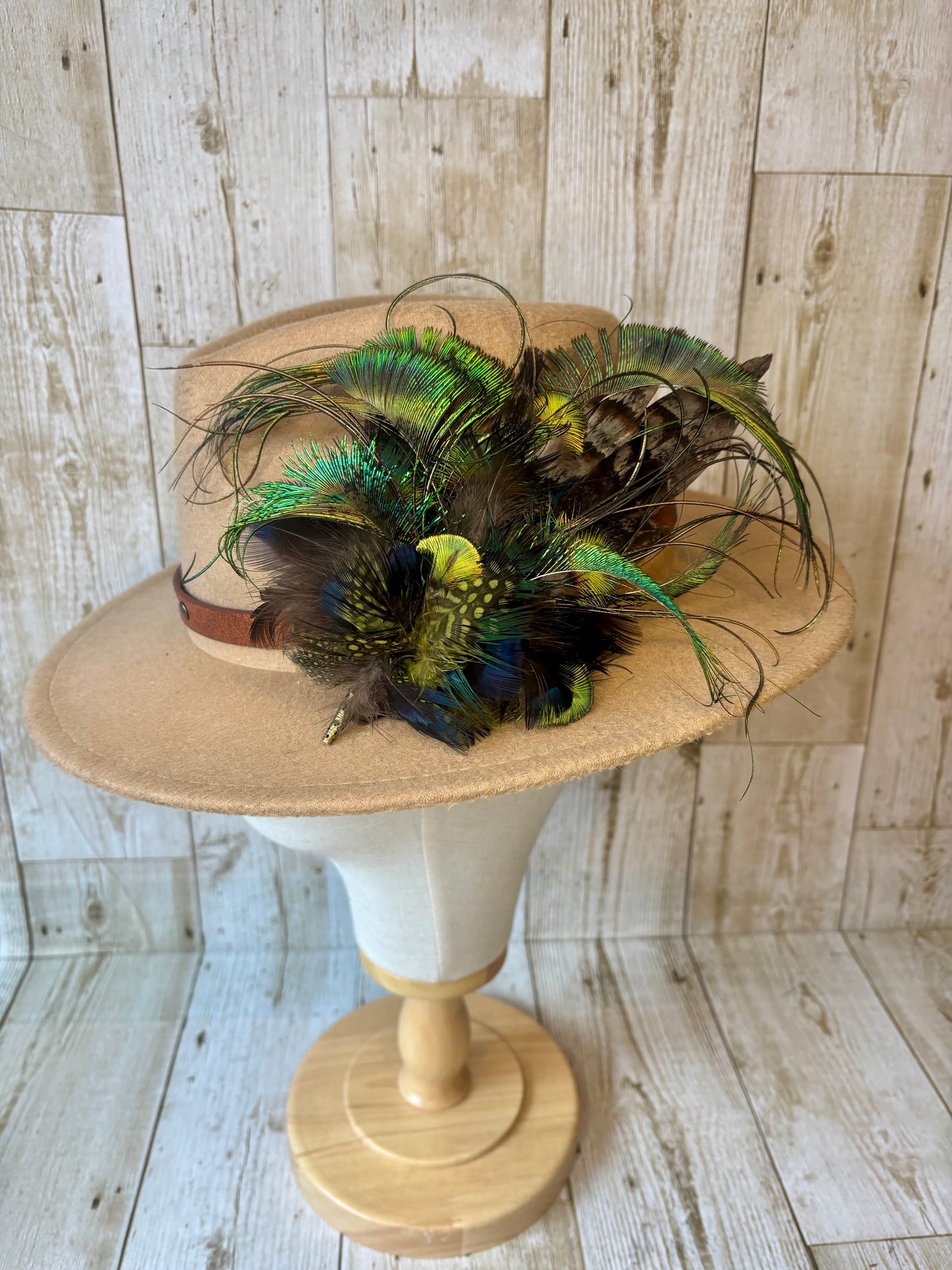Hat pin with melanistic pheasant and peacock.