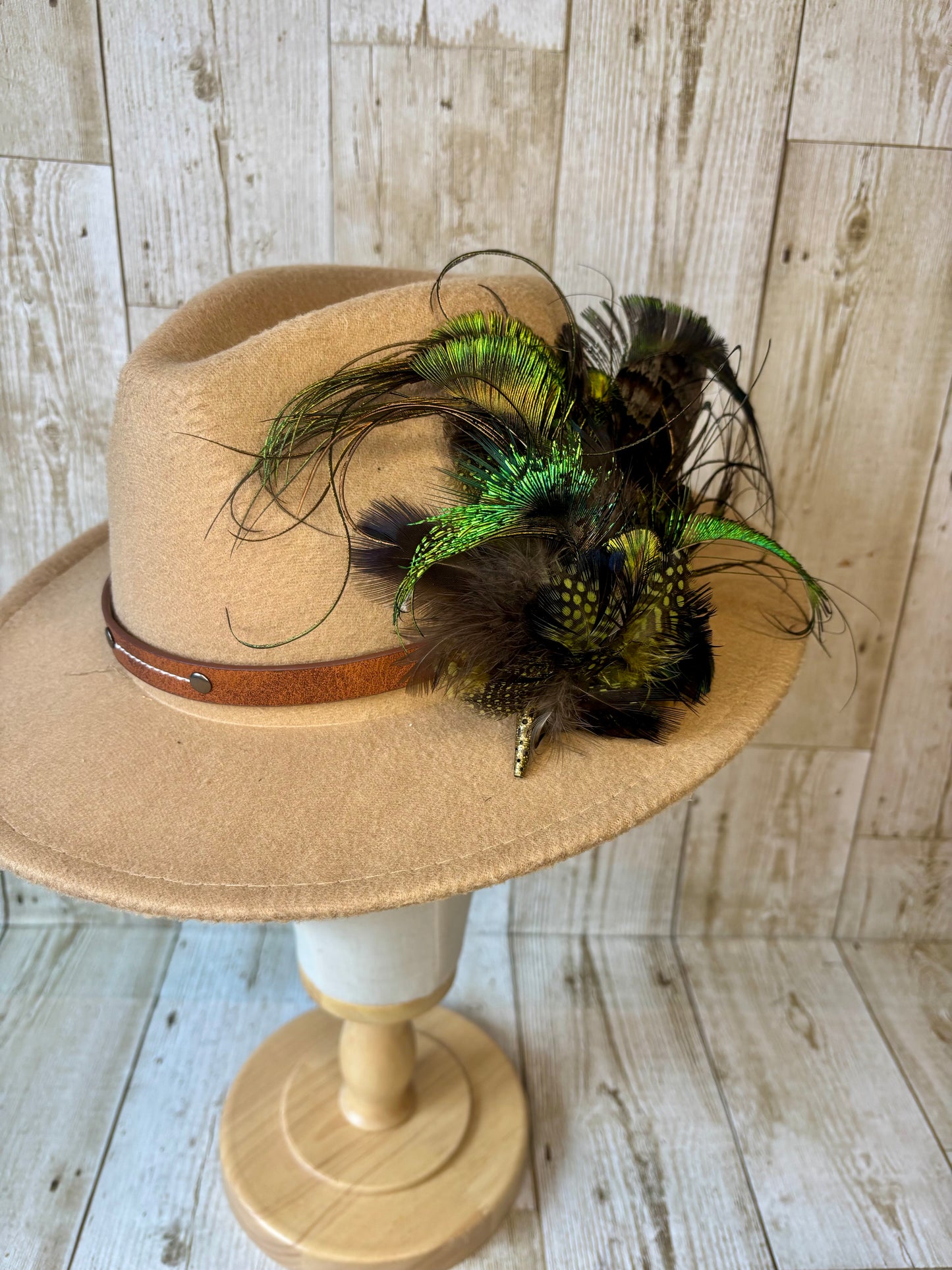 Hat pin with melanistic pheasant and peacock.