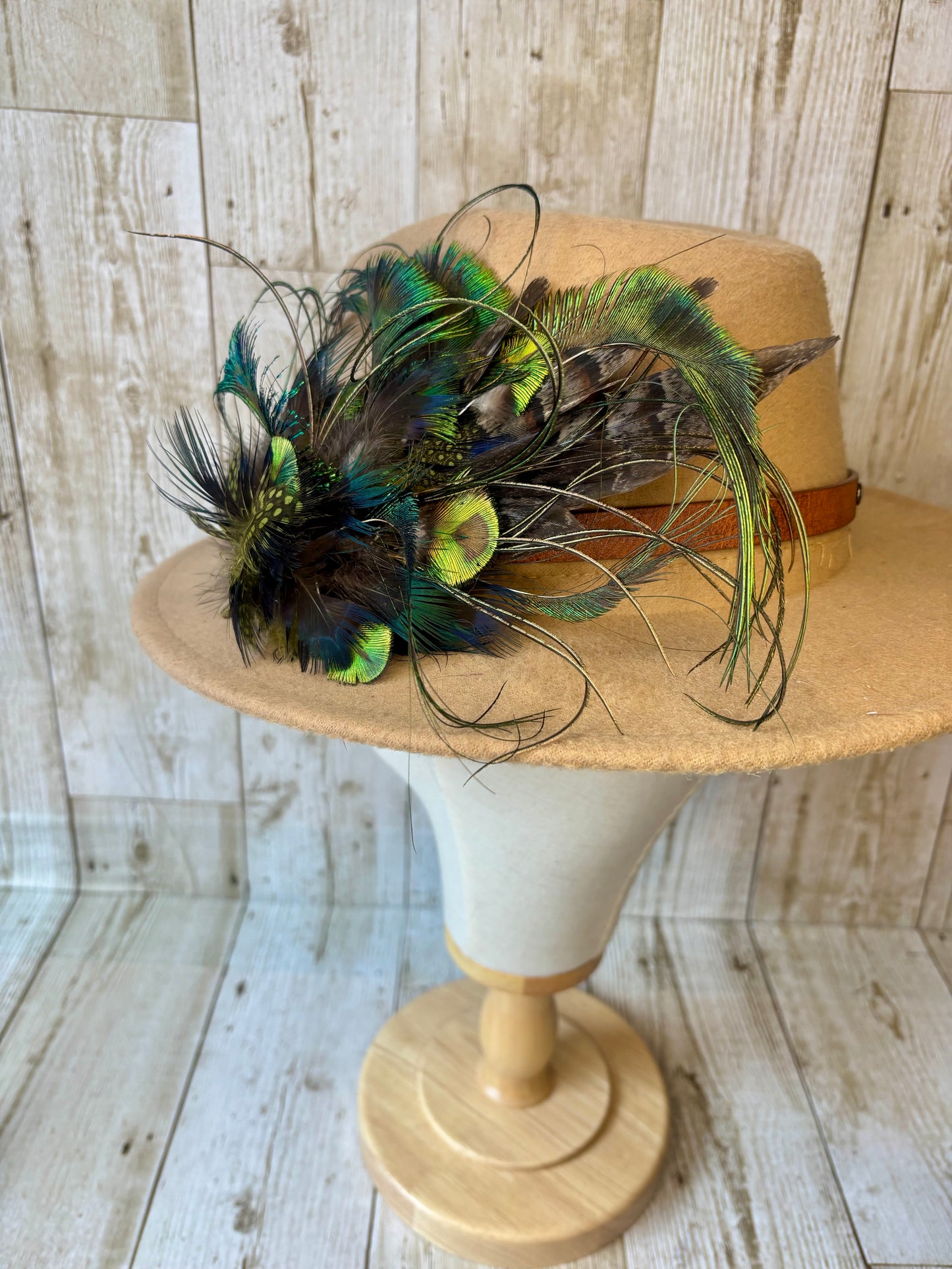 Hat pin with melanistic pheasant and peacock.