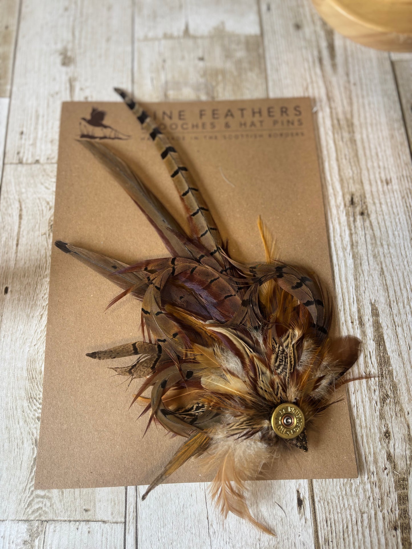 Pheasant feather hat pin.