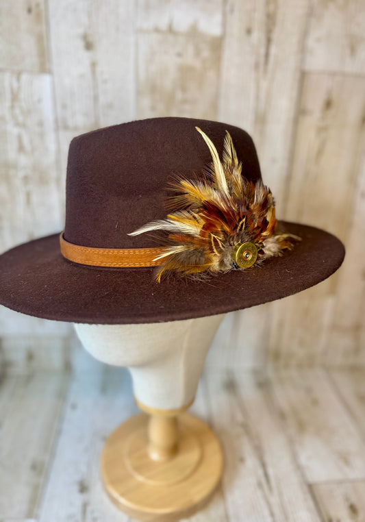 Pheasant feather hat pin with cartridge end.