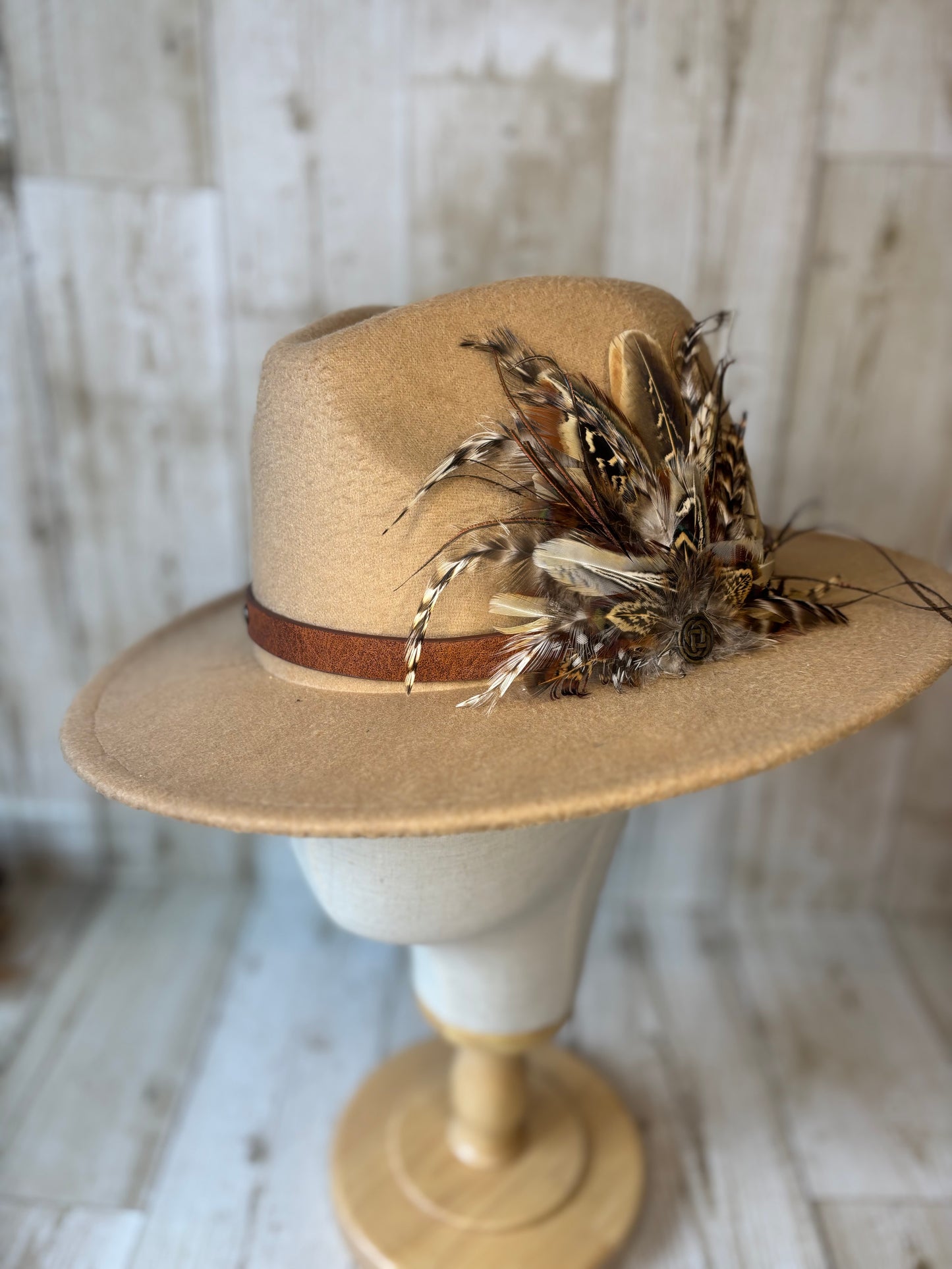 Pheasant feather hat pin with Celtic button.