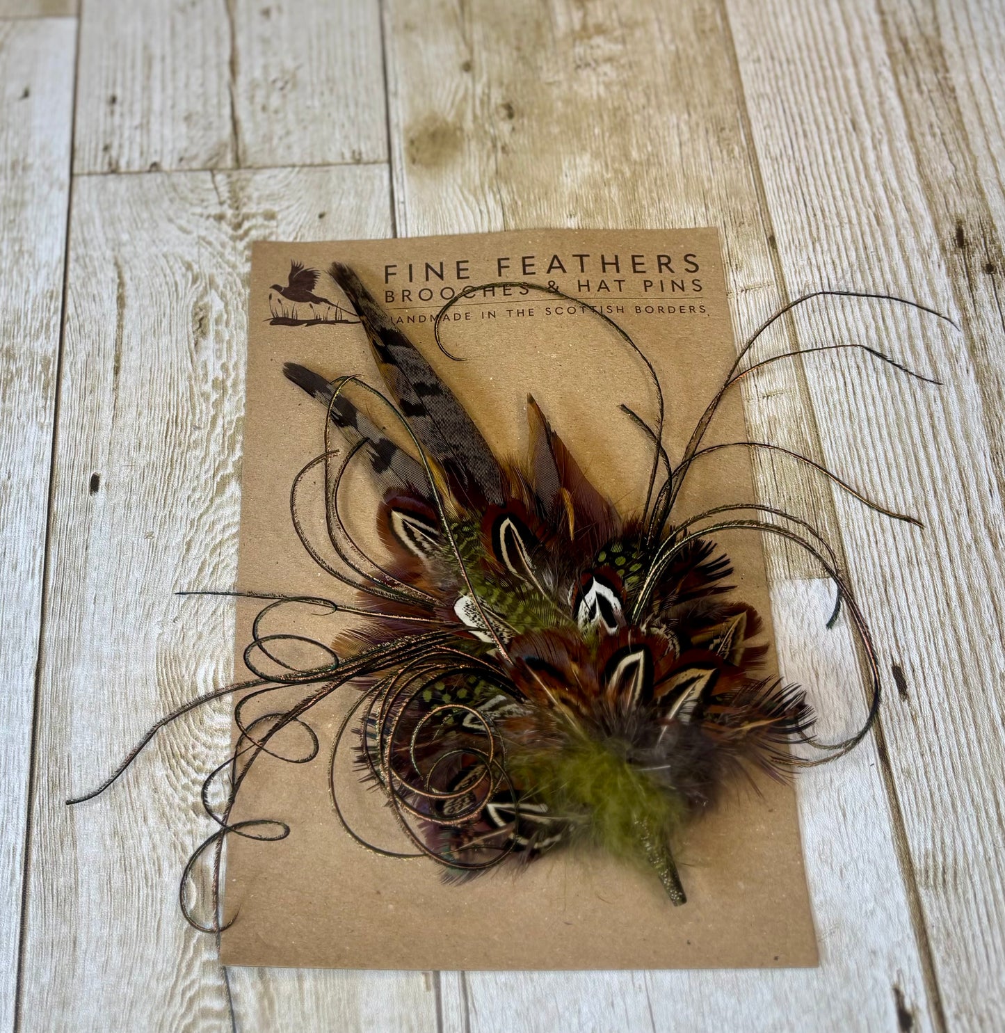 Pheasant feather hat pin with sage green.