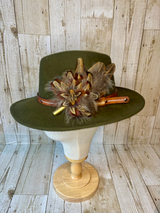 Pheasant feather hat pin with brass casing.