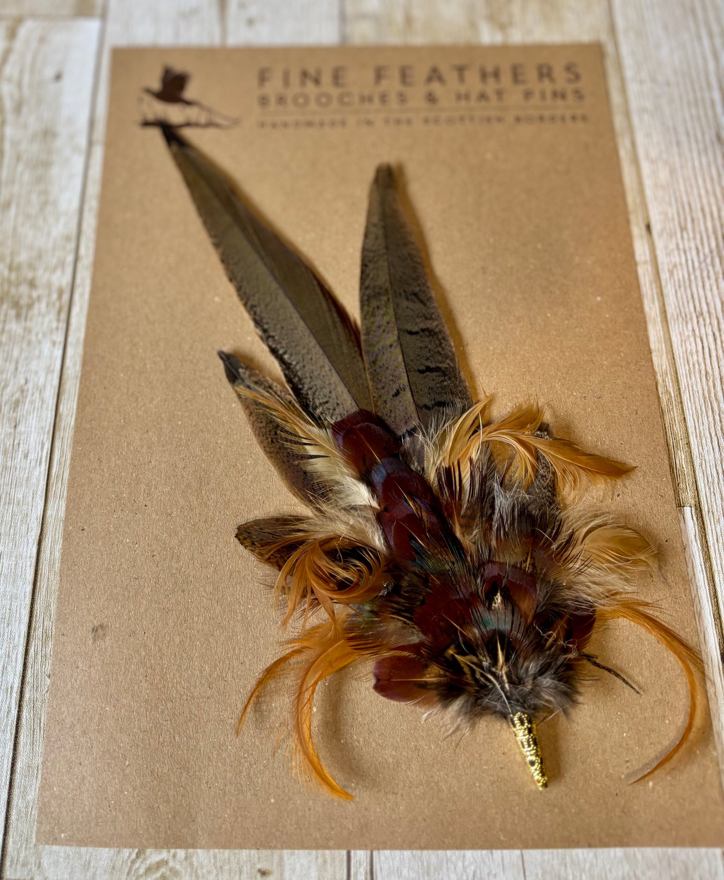Pheasant feather hat pin.