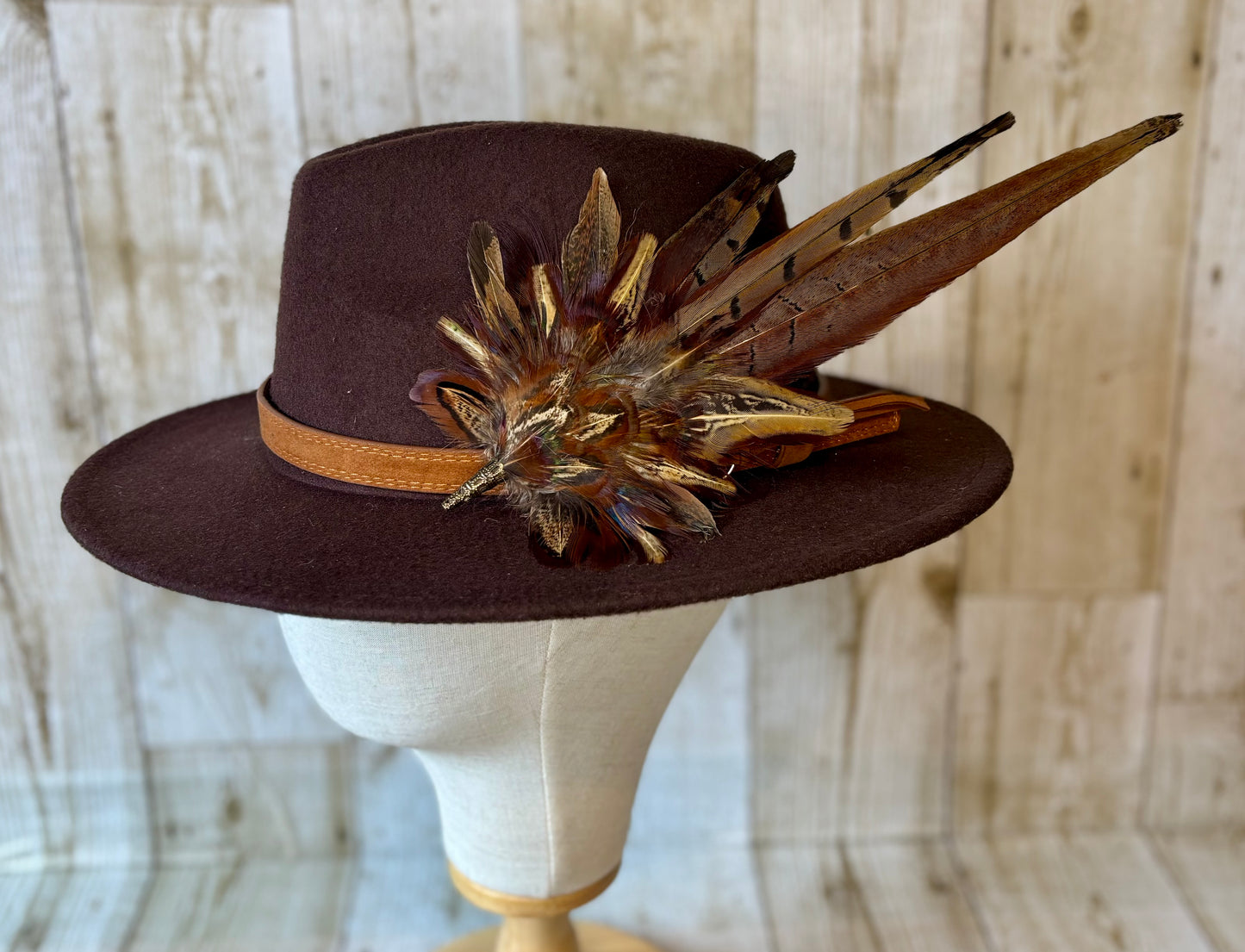 Pheasant feather hat pin.