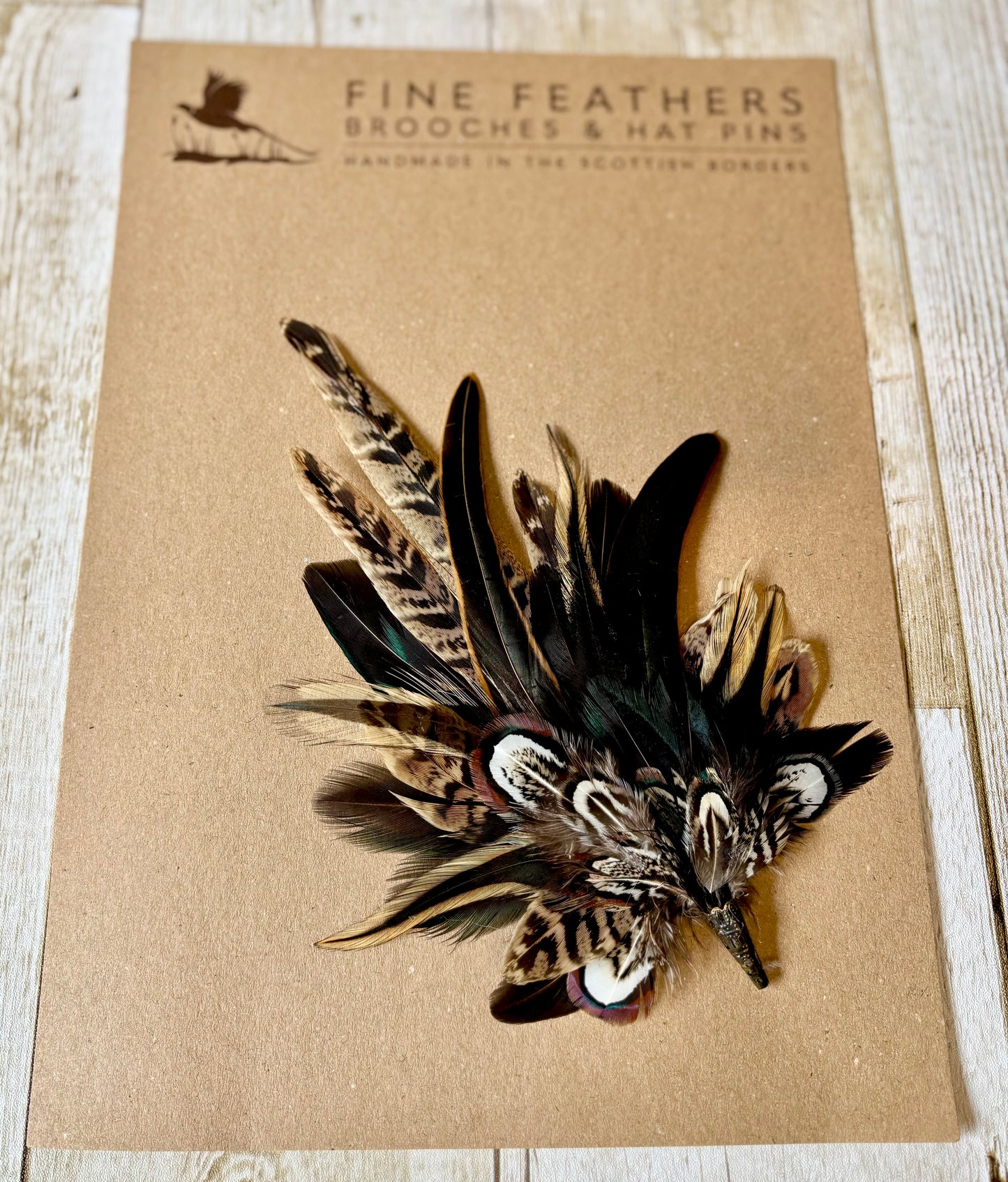 Pheasant feather hat pin.