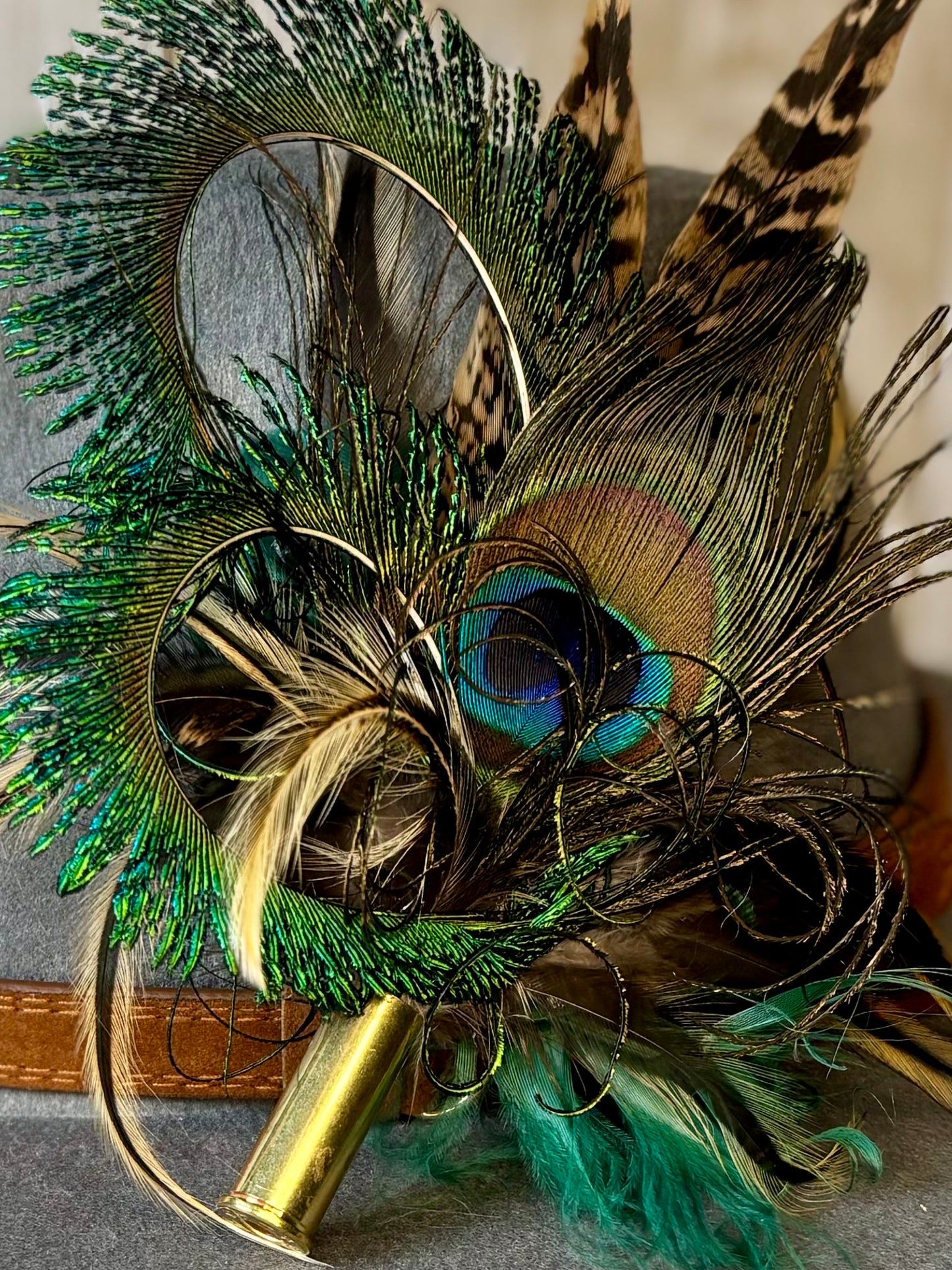 Pheasant feather and peacock feather pin.