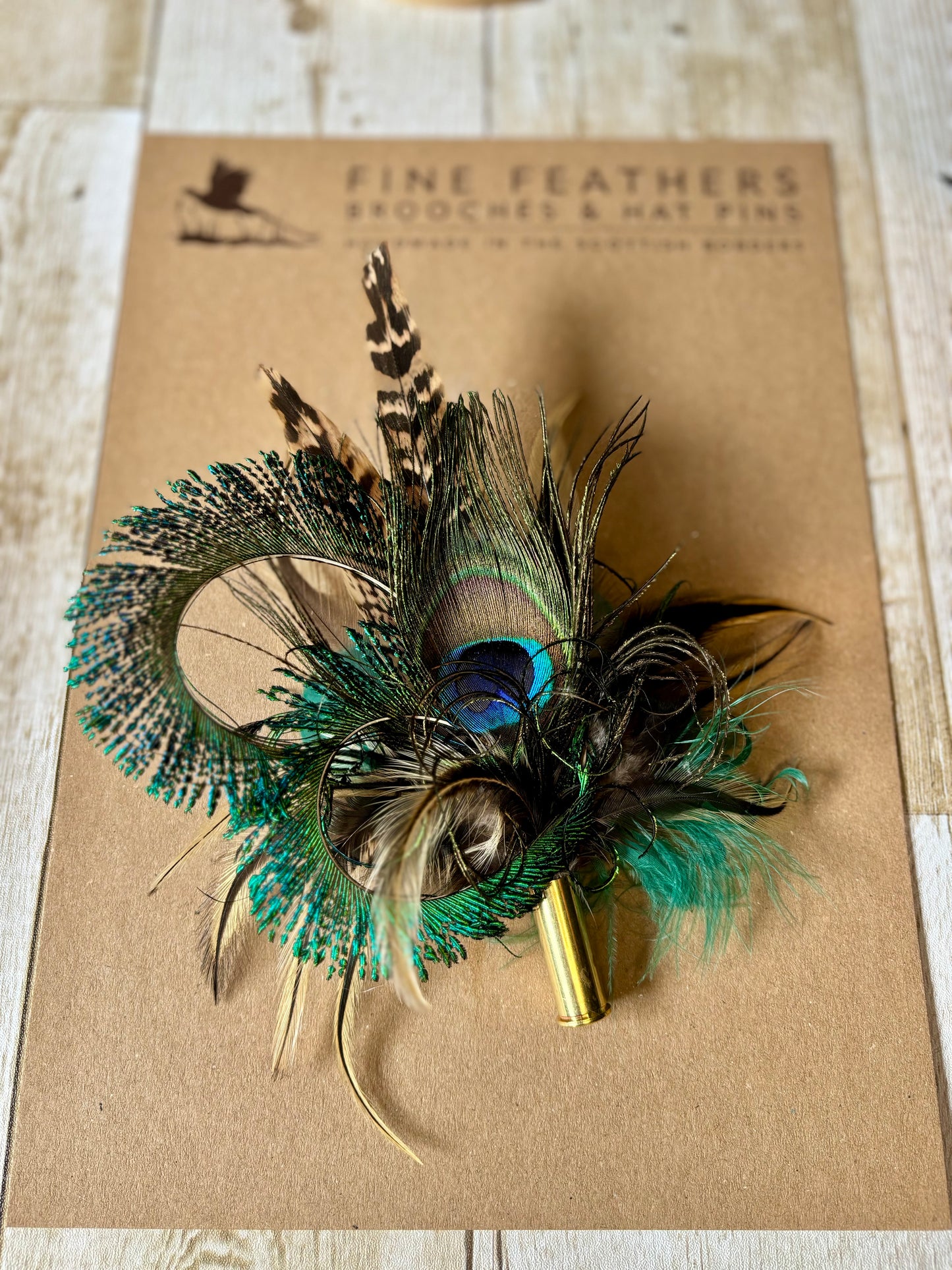 Pheasant feather and peacock feather pin.