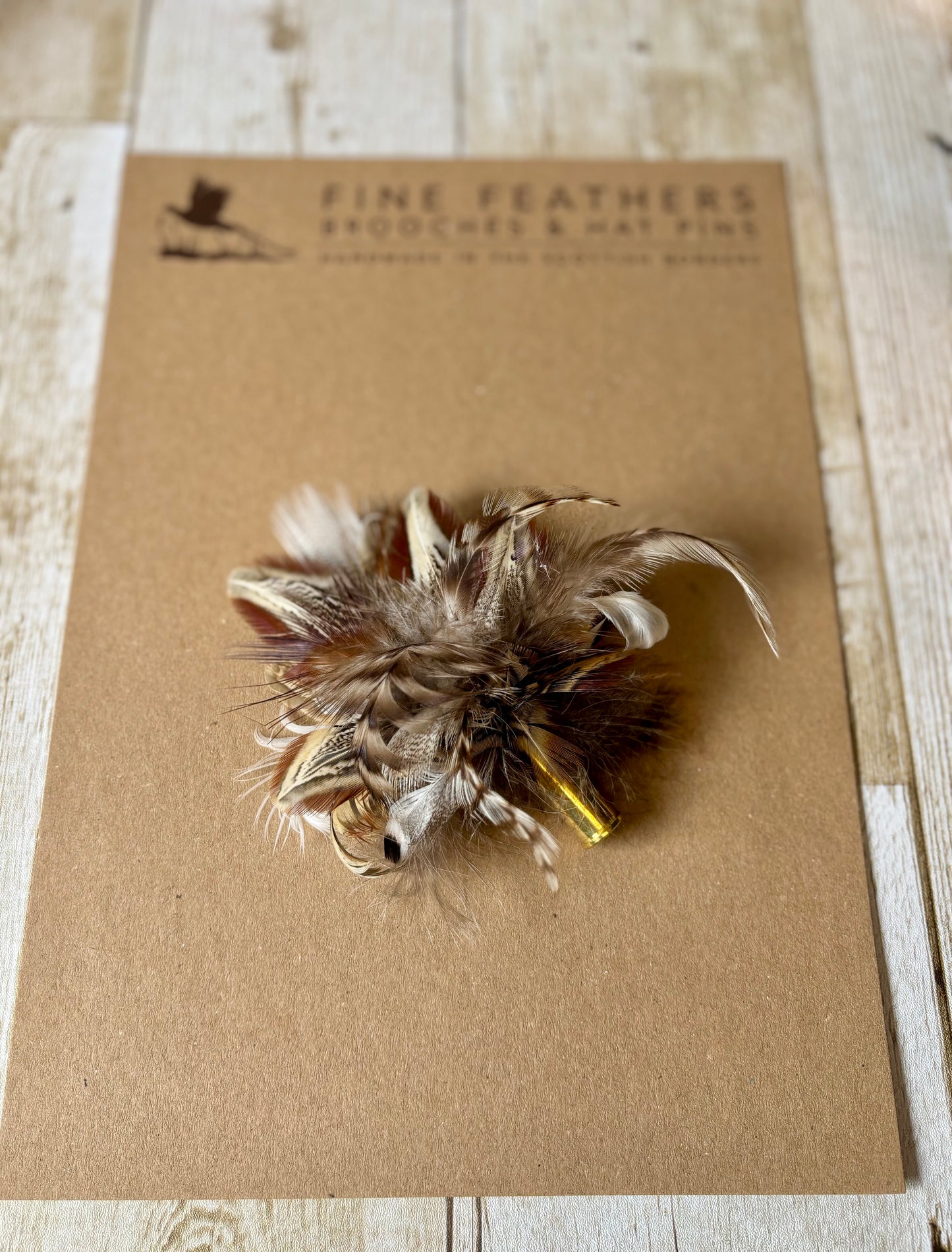 Pheasant feather hat pin.